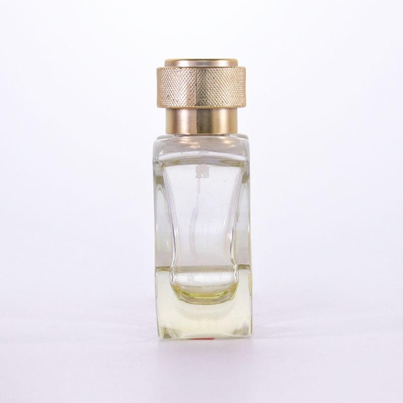 Empty Yellow Glass Cologne Bottle